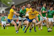 12 July 2015; Richard O'Callaghan, Fermamagh, in action against Donal Shine, left, and David Keenan, Roscommon. GAA Football All-Ireland Senior Championship, Round 3A, Fermamagh v Roscommon, Brewster Park, Fermanagh. Photo by Sportsfile