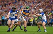 12 July 2015; James Woodlock, Tipperary, in action against Kevin Moran, left, Colin Dunford, and Shane Fives, right, Waterford. Munster GAA Hurling Senior Championship Final, Tipperary v Waterford, Semple Stadium, Thurles, Co. Tipperary. Picture credit: Ray McManus / SPORTSFILE