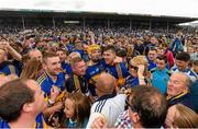 12 July 2015; Lar Corbett, left, and Seamus Callanan, Tipperary, celebrate amongst supporters following their victory. Munster GAA Hurling Senior Championship Final, Tipperary v Waterford. Semple Stadium, Thurles, Co. Tipperary. Picture credit: Stephen McCarthy / SPORTSFILE