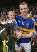 12 July 2015; Tipperary's Lar Corbett and his one year old daughter Fay with the cup after the game. Munster GAA Hurling Senior Championship Final, Tipperary v Waterford, Semple Stadium, Thurles, Co. Tipperary. Picture credit: Ray McManus / SPORTSFILE
