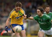 12 July 2015; Ultan Harney, Roscommon, in action against Tiarnan Daly, Fermamagh. GAA Football All-Ireland Senior Championship, Round 3A, Fermamagh v Roscommon, Brewster Park, Fermanagh. Photo by Sportsfile