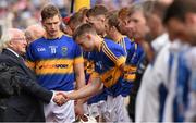 12 July 2015; Tipperary captain Brendan Maher introduces team mate Shane McGrath to the president of Ireland Michael D Higgins before the game. Munster GAA Hurling Senior Championship Final, Tipperary v Waterford, Semple Stadium, Thurles, Co. Tipperary. Picture credit: Ray McManus / SPORTSFILE