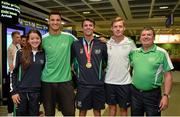 13 July 2015; The Ireland athletics squad of, from left, Ciara Everard, Adam McMullen, Thomas Barr, Kevin Batt and Neil Martin, team manager, pictured in Dublin Airport on their arrival home from the World University Games in Gwangju South Korea. Dublin Airport, Dublin. Picture credit: Piaras Ó Mídheach / SPORTSFILE