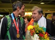 13 July 2015; Ireland's Thomas Barr pictured with Ferrybank AC founder Andy Hallissey in Dublin Airport on his arrival home from the World University Games in Gwangju South Korea. Dublin Airport, Dublin. Picture credit: Piaras Ó Mídheach / SPORTSFILE