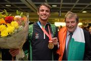 13 July 2015; Ireland's Thomas Barr pictured with Ferrybank AC founder Andy Hallissey in Dublin Airport on his arrival home from the World University Games in Gwangju South Korea. Dublin Airport, Dublin. Picture credit: Piaras Ó Mídheach / SPORTSFILE