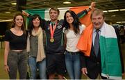 13 July 2015; Ireland's Thomas Barr pictured with his sisters Becky, left, Jessie, his mother Martina, second from left, and Ferrybank AC founder Andy Hallissey in Dublin Airport on his arrival home from the World University Games in Gwangju South Korea. Dublin Airport, Dublin. Picture credit: Piaras Ó Mídheach / SPORTSFILE