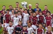 14 July 2015; Twelve year old Andrew Brennan Smyth, from the Village in Kilkenny, but a member of the Dicksboro GAA Club, lifts the Liam MacCarthy Cup as he and his club mates assemble with Uachtarán Chumann Lúthchleas Gael Aogán Ó Fearghail, GAA stars  Noel Connors, Waterford, Cillian Buckley, Kilkenny, Kieran Bergin, Tipperary, and Andy Smith, Galway, at the launch of the GAA Hurling All-Ireland Senior Championship Series 2015. Dicksboro GAA Club, Kilkenny. Picture credit: Ray McManus / SPORTSFILE