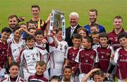 14 July 2015; Twelve year old Andrew Brennan Smyth, from the Village, in Kilkenny, but a member of the Dicksboro GAA Club, lifts the Liam MacCarthy Cup as he and his club mates assemble with Uachtarán Chumann Lúthchleas Gael Aogán Ó Fearghail, GAA stars  Noel Connors, Waterford, Cillian Buckley, Kilkenny, Kieran Bergin, Tipperary, and Andy Smith, Galway, at the launch of the GAA Hurling All-Ireland Senior Championship Series 2015. Dicksboro GAA Club, Kilkenny. Picture credit: Ray McManus / SPORTSFILE