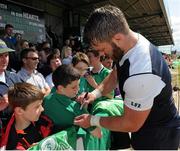 14 July 2015; Ireland's Sean O'Brien signs a supporter's shirt during squad training. Sportsground, Galway. Picture credit: Seb Daly / SPORTSFILE