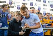 15 July 2015; Jack Mulhall, aged 9, from Dungarvan, presents Clare's Bobby Duggan with the man of the match award after the game. Bord Gáis Energy Munster GAA U21 Hurling Championship, Semi-Final, Clare v Waterford, Cusack Park, Ennis, Co. Clare. Picture credit: Piaras Ó Mídheach / SPORTSFILE