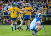 15 July 2015; Clare's Conor Cleary, right, Michael O'Malley, centre, and Ben O'Gorman, celebrate at the final whistle after defeating Waterford. Bord Gáis Energy Munster GAA u21 Hurling Championship, Semi-Final, Clare v Waterford, Cusack Park, Ennis, Co. Clare. Picture credit: Diarmuid Greene / SPORTSFILE