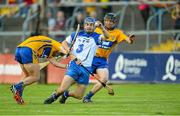 15 July 2015; Colin Dunford, Waterford, is fouled by Clare's Eoin Quirke, left, supported by Aidan McGuane, right, during the final moments of the game. Bord Gáis Energy Munster GAA u21 Hurling Championship, Semi-Final, Clare v Waterford, Cusack Park, Ennis, Co. Clare. Picture credit: Diarmuid Greene / SPORTSFILE