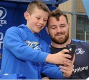 16 July 2015; Cian Healy and Gordon D'Arcy of Leinster Rugby came out to the Bank of Ireland Summer Camp to meet up with some local young rugby talent at Lansdowne FC. Pictured is Cian Healy posing for a photograph with one of the participants of the summer camp. Lansdowne FC, Lansdowne Road, Dublin. Picture credit: Seb Daly / SPORTSFILE