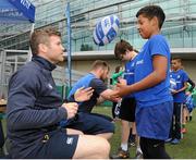 16 July 2015; Cian Healy and Gordon D'Arcy of Leinster Rugby came out to the Bank of Ireland Summer Camp to meet up with some local young rugby talent at Lansdowne FC. Pictured is Gordon D'Arcy handing a ball back to one of the participants of the summer camp. Lansdowne FC, Lansdowne Road, Dublin. Picture credit: Seb Daly / SPORTSFILE