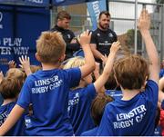 16 July 2015; Cian Healy and Gordon D'Arcy of Leinster Rugby came out to the Bank of Ireland Summer Camp to meet up with some local young rugby talent at Lansdowne FC. Pictured are particiapants of the summer camp asking Cian Healy and Gordon D'Arcy questions. Lansdowne FC, Lansdowne Road, Dublin. Picture credit: Seb Daly / SPORTSFILE
