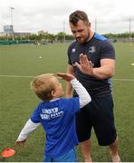 16 July 2015; Cian Healy and Gordon D'Arcy of Leinster Rugby came out to the Bank of Ireland Summer Camp to meet up with some local young rugby talent at Lansdowne FC. Pictured is Cian Healy being given a high-five by a participant of the summer camp. Lansdowne FC, Lansdowne Road, Dublin. Picture credit: Seb Daly / SPORTSFILE