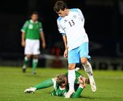 15 October 2008; Matteo Vitaiolix, San Marino, stumbles over the arm of Grant McCann, Northern Ireland. 2010 World Cup Qualifier, Northern Ireland v San Marino, Windsor Park, Belfast. Picture credit: Oliver McVeigh / SPORTSFILE
