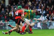 19 October 2008; Cathal O'Reilly, Ahane, in action against Donncha Sheehan, left, and Liam Costello, Adare. Limerick Senior Hurling Final, Adare v Ahane, Gaelic Grounds, Limerick. Picture credit: Brian Lawless / SPORTSFILE