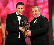 17 October 2008; Conor Gormley of Tyrone is presented with his GAA All-Star award by Nickey Brennan, GAA President, during the 2008 GAA All-Stars sponsored by Vodafone. Citywest Hotel, Conference, Leisure & Golf Resort, Dublin. Picture credit: Brendan Moran / SPORTSFILE