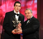 17 October 2008; Justin McMahon of Tyrone is presented with his GAA All-Star award by Nickey Brennan, GAA President, during the 2008 GAA All-Stars sponsored by Vodafone. Citywest Hotel, Conference, Leisure & Golf Resort, Dublin. Picture credit: Brendan Moran / SPORTSFILE