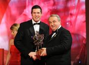 17 October 2008; Sean Cavanagh of Tyrone is presented with his GAA All-Star award by Nickey Brennan, GAA President, during the 2008 GAA All-Stars sponsored by Vodafone. Citywest Hotel, Conference, Leisure & Golf Resort, Dublin. Picture credit: Brendan Moran / SPORTSFILE