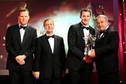 17 October 2008; Jackie Tyrrell of Kilkenny is presented with his GAA All-Star award by Nickey Brennan, GAA President, in the company of Minister for Arts, Sport and Tourism, Martin Cullen T.D., and Charles Butterworth, CEO Vodafone Ireland, left, during the 2008 GAA All-Stars sponsored by Vodafone. Citywest Hotel, Conference, Leisure & Golf Resort, Dublin. Picture credit: Brendan Moran / SPORTSFILE