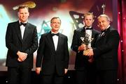 17 October 2008; Tommy Walsh of Kilkenny is presented with his GAA All-Star award by Nickey Brennan, GAA President, in the company of Minister for Arts, Sport and Tourism, Martin Cullen T.D., and Charles Butterworth, CEO Vodafone Ireland, left, during the 2008 GAA All-Stars sponsored by Vodafone. Citywest Hotel, Conference, Leisure & Golf Resort, Dublin. Picture credit: Brendan Moran / SPORTSFILE