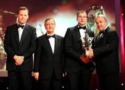 17 October 2008; JJ Delaney of Kilkenny is presented with his GAA All-Star award by Nickey Brennan, GAA President, in the company of Minister for Arts, Sport and Tourism, Martin Cullen T.D., and Charles Butterworth, CEO Vodafone Ireland, left, during the 2008 GAA All-Stars sponsored by Vodafone. Citywest Hotel, Conference, Leisure & Golf Resort, Dublin. Picture credit: Brendan Moran / SPORTSFILE