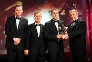 17 October 2008; Ben O'Connor of Cork is presented with his GAA All-Star award by Nickey Brennan, GAA President, in the company of Minister for Arts, Sport and Tourism, Martin Cullen T.D., and Charles Butterworth, CEO Vodafone Ireland, left, during the 2008 GAA All-Stars sponsored by Vodafone. Citywest Hotel, Conference, Leisure & Golf Resort, Dublin. Picture credit: Brendan Moran / SPORTSFILE