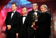 17 October 2008; Eoin Larkin of Kilkenny is presented with his GAA All-Star award by Nickey Brennan, GAA President, in the company of Minister for Arts, Sport and Tourism, Martin Cullen T.D., and Charles Butterworth, CEO Vodafone Ireland, left, during the 2008 GAA All-Stars sponsored by Vodafone. Citywest Hotel, Conference, Leisure & Golf Resort, Dublin. Picture credit: Ray McManus / SPORTSFILE