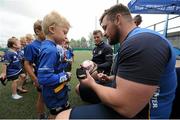 16 July 2015; Cian Healy and Gordon D'Arcy of Leinster Rugby came out to the Bank of Ireland Summer Camp to meet up with some local young rugby talent at Lansdowne FC. Pictured is Cian Healy signing a football boot for one of the participants of the summer camp. Lansdowne FC, Lansdowne Road, Dublin. Picture credit: Seb Daly / SPORTSFILE