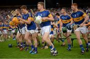 12 July 2015; Tipperary players break away after the pre-match team photograph. Munster GAA Hurling Senior Championship Final, Tipperary v Waterford. Semple Stadium, Thurles, Co. Tipperary. Picture credit: Piaras Ó Mídheach / SPORTSFILE