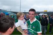 16 July 2015; Colin Ryan, Limerick, celebrates with his Pallasgreen club mate Jacob Murphy-Ryan, aged 3, after the game. Bord Gáis Energy Munster GAA U21 Hurling Championship, Semi-Final, Limerick v Tipperary. Gaelic Grounds, Limerick. Picture credit: Dáire Brennan / SPORTSFILE