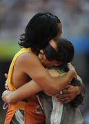 15 September 2008; Brazil's Jerusa Santos celebrates with her guide after finishing first and qualifying in a season's best time of 26.05 during the Women's 200m - T11 heats. Beijing Paralympic Games 2008, Women's 200m - T11, Heat 1, National Stadium, Olympic Green, Beijing, China. Picture credit: Brian Lawless / SPORTSFILE