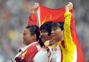 15 September 2008; Chinese athletes gold medalist Jun Wang, centre, silver medalist Yue Yang, left, and bronze medalist Baozhu Zheng, celebrate on the podium after the Women's Discus F42 - 46 Final. Beijing Paralympic Games 2008, Women's Discus F42 - 46 Final, National Stadium, Olympic Green, Beijing, China. Picture credit: Brian Lawless / SPORTSFILE