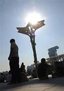 15 September 2008; Fans shelter from the sun outside the 'Bird's Nest'. Beijing Paralympic Games 2008, National Stadium, Olympic Green, Beijing, China. Picture credit: Brian Lawless / SPORTSFILE