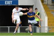 18 July 2015; Sean Cavanagh, Tyrone, shoots to score his side's second point despite pressure from Robbie Kiely, Tipperary. GAA Football All-Ireland Senior Championship, Round 3B, Tipperary v Tyrone. Semple Stadium, Thurles, Co. Tipperary. Picture credit: Diarmuid Greene / SPORTSFILE