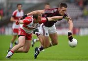 18 July 2015; Fiontan O Curraoin, Galway, in action against Sean Leo McGoldrick, Derry. GAA Football All-Ireland Senior Championship, Round 3B, Galway v Derry, Pearse Stadium, Salthill, Co. Galway. Photo by Sportsfile