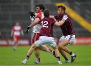 18 July 2015; Mark Lynch, Derry, in action against Michael Lundy and Paul Conroy, right, Galway. GAA Football All-Ireland Senior Championship, Round 3B, Galway v Derry, Pearse Stadium, Salthill, Co. Galway. Photo by Sportsfile