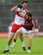 18 July 2015; Mark Lynch, Derry, in action against Michael Lundy, Galway. GAA Football All-Ireland Senior Championship, Round 3B, Galway v Derry, Pearse Stadium, Salthill, Co. Galway. Photo by Sportsfile