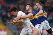18 July 2015; Mattie Donnelly, Tyrone, in action against Paddy Codd, Tipperary. GAA Football All-Ireland Senior Championship, Round 3B, Tipperary v Tyrone. Semple Stadium, Thurles, Co. Tipperary. Picture credit: Diarmuid Greene / SPORTSFILE