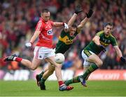 18 July 2015; Paul Kerrigan, Cork, shoots to score his side's first goal despite the attention of Kerry's Jonathan Lyne and David Moran, right. Munster GAA Football Senior Championship Final Replay, Kerry v Cork. Fitzgerald Stadium, Killarney, Co. Kerry. Picture credit: Stephen McCarthy / SPORTSFILE