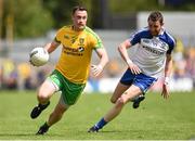 19 July 2015; Martin McElhinney, Donegal, in action against Owen Duffy, Monaghan. Ulster GAA Football Senior Championship Final, Donegal v Monaghan, St Tiernach's Park, Clones, Co. Monaghan. Picture credit: Stephen McCarthy / SPORTSFILE