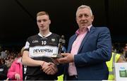 19 July 2015; Pictured is Kevin Molloy, Customer Relationship Manager for Electric Ireland, proud sponsor of the GAA All-Ireland Minor Championships, presenting Liam Gaughan from Sligo with the Player of the Match award for his outstanding performance in the Electric Ireland Connacht Minor Football Championship Final. Throughout the Championship fans can follow the action, support the Minors and be a part of something major through the hashtag #ThisIsMajor. Electric Ireland Connacht GAA Football Minor Championship Final, Galway v Sligo, Dr. Hyde Park, Roscommon. Photo by Sportsfile