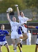 26 October 2008; Kevin Donnelly, Dromore, in action against Gary Coney and Patrick Doris, Clonoe. Tyrone Senior Football Final, Dromore v Clonoe, Healy Park, Omagh, Co. Tyrone. Picture credit: Michael Cullen / SPORTSFILE