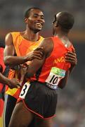 15 September 2008; A guide celebrates with an Angolan athlete after they qualified for the final of the Men's 4 X 100m Relay - T11-T13 event. Beijing Paralympic Games 2008, Men's 4 X 100m Relay - T11-T13, Heat 3, National Stadium, Olympic Green, Beijing, China. Picture credit: Brian Lawless / SPORTSFILE