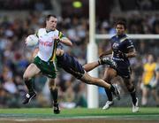 24 October 2008; Ciaran McKeever, Ireland, escapes a tackle from Australia's Jared Brennan. 2008 Toyota International Rules Series, Australia v Ireland, Subiaco Oval, Perth, Western Australia. Picture credit: Ray McManus / SPORTSFILE