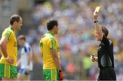 19 July 2015; Referee David Coldrick shows Frank McGlynn, Donegal as yellow card in the first half as Michael Murphy watches. Ulster GAA Football Senior Championship Final, Donegal v Monaghan, St Tiernach's Park, Clones, Co. Monaghan. Picture credit: Oliver McVeigh / SPORTSFILE