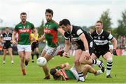 19 July 2015; Pat Hughes, Sligo, in action against Ger Cafferkey, Mayo. Connacht GAA Football Senior Championship Final, Mayo v Sligo, Dr. Hyde Park, Roscommon. Picture credit: David Maher / SPORTSFILE