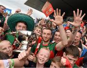 19 July 2015; Keith Higgins, Mayo, captain celebrates with supporters after Mayo won their fifth Nestor Cup in a row. Connacht GAA Football Senior Championship Final, Mayo v Sligo, Dr. Hyde Park, Roscommon. Picture credit: David Maher / SPORTSFILE